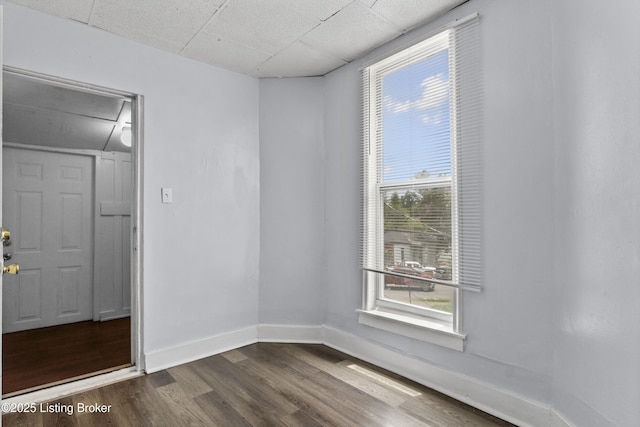 1373 Cypress St, Louisville, KY 40211 - unfurnished room with attic access and dark wood-style flooring