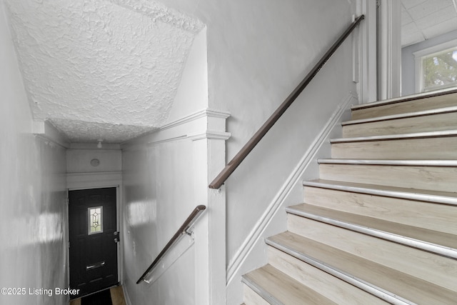 1373 Cypress St, Louisville, KY 40211 - stairway featuring a textured ceiling