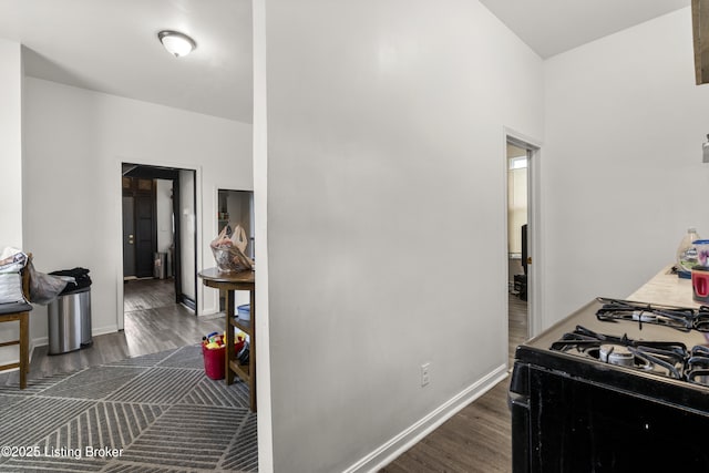 1373 Cypress St, Louisville, KY 40211 - kitchen with black range with gas cooktop and dark wood-type flooring