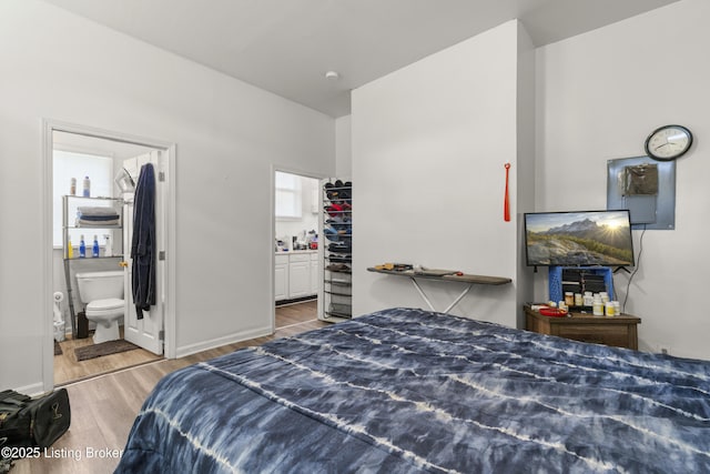 1373 Cypress St, Louisville, KY 40211 - bedroom featuring wood finished floors and ensuite bath