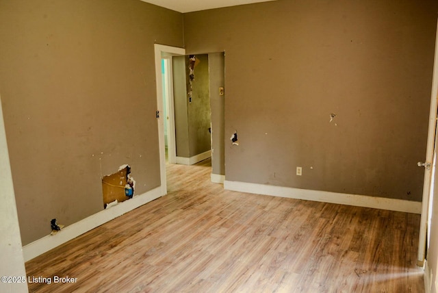 2809 Rowan St, Louisville, KY 40212 - unfurnished room with wood finished floors and baseboards