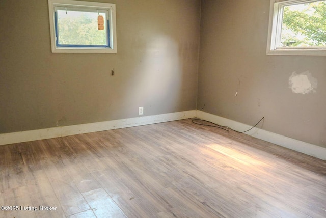 2809 Rowan St, Louisville, KY 40212 - empty room featuring wood finished floors and baseboards