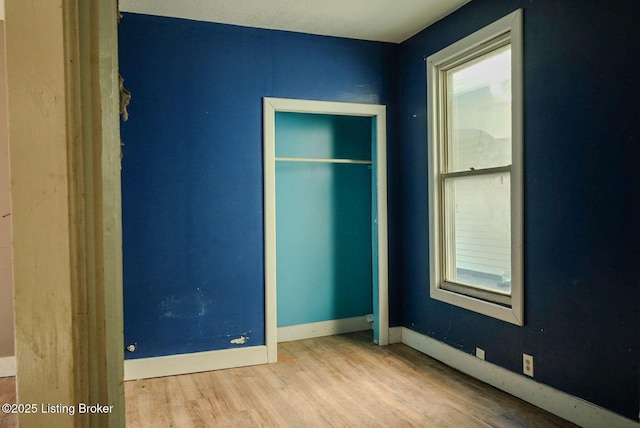 2809 Rowan St, Louisville, KY 40212 - unfurnished bedroom featuring wood finished floors and baseboards