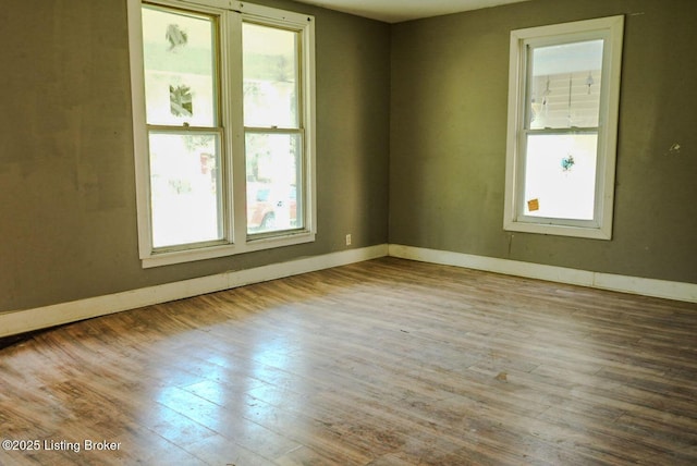 2809 Rowan St, Louisville, KY 40212 - unfurnished room with baseboards and wood finished floors