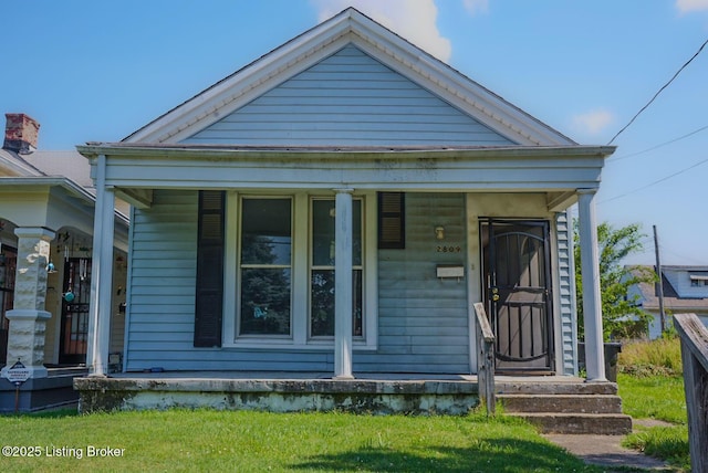 2809 Rowan St, Louisville, KY 40212 - shotgun-style home with covered porch