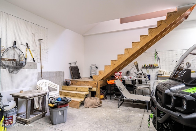 309 Clarks Ln, Clarkson, KY 42726 - interior space featuring unfinished concrete floors, stairs, and vaulted ceiling