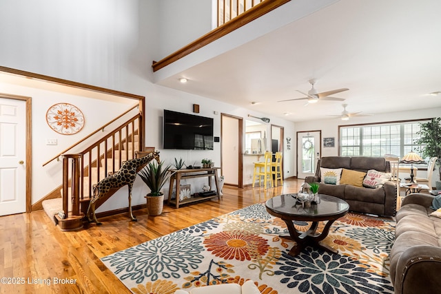 309 Clarks Ln, Clarkson, KY 42726 - living room featuring stairs, ceiling fan, and light wood-style flooring