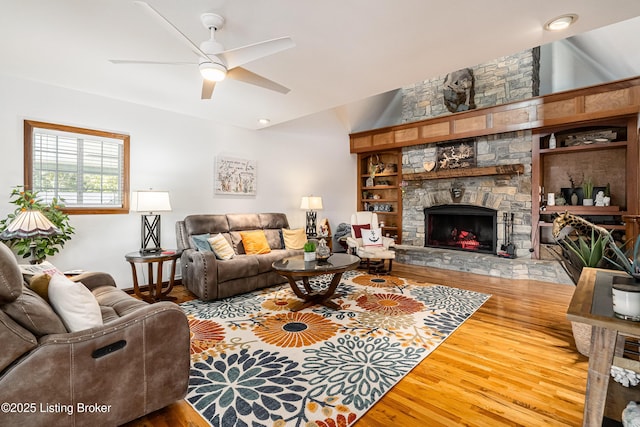 309 Clarks Ln, Clarkson, KY 42726 - living room with wood finished floors, ceiling fan, and a fireplace