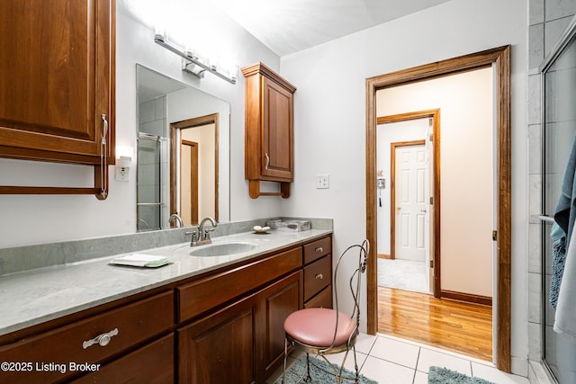 309 Clarks Ln, Clarkson, KY 42726 - bathroom featuring tile patterned flooring, vanity, and an enclosed shower