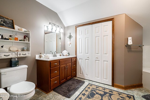 309 Clarks Ln, Clarkson, KY 42726 - bathroom with a closet, vanity, vaulted ceiling, and a tub