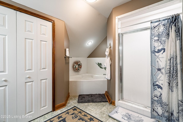 309 Clarks Ln, Clarkson, KY 42726 - full bath featuring vaulted ceiling, a shower stall, a garden tub, and a closet