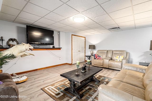 309 Clarks Ln, Clarkson, KY 42726 - living area featuring wood finished floors and a paneled ceiling