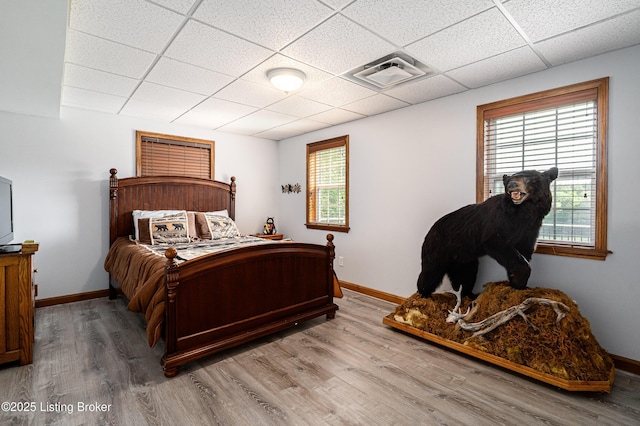 309 Clarks Ln, Clarkson, KY 42726 - bedroom featuring a drop ceiling and wood finished floors