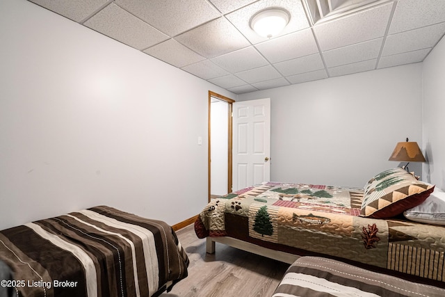 309 Clarks Ln, Clarkson, KY 42726 - bedroom with wood finished floors and a drop ceiling