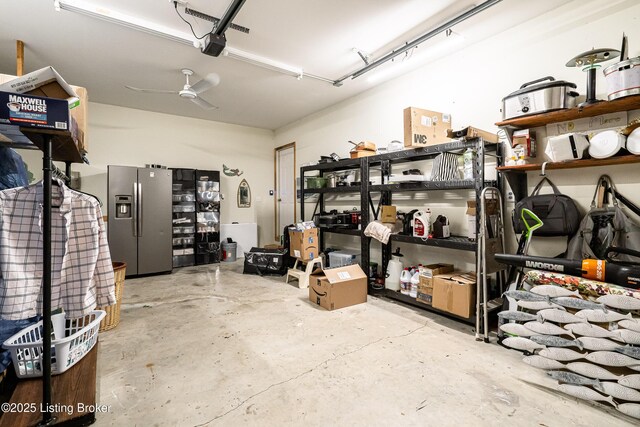 309 Clarks Ln, Clarkson, KY 42726 - garage featuring stainless steel fridge with ice dispenser and a garage door opener