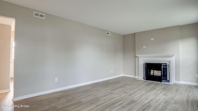 4720 Ferrer Way, Jeffersontown, KY 40299 - unfurnished living room featuring light wood-style flooring and a fireplace with flush hearth