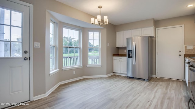 4720 Ferrer Way, Jeffersontown, KY 40299 - kitchen featuring stainless steel refrigerator with ice dispenser, healthy amount of natural light, a chandelier, white cabinetry, and recessed lighting