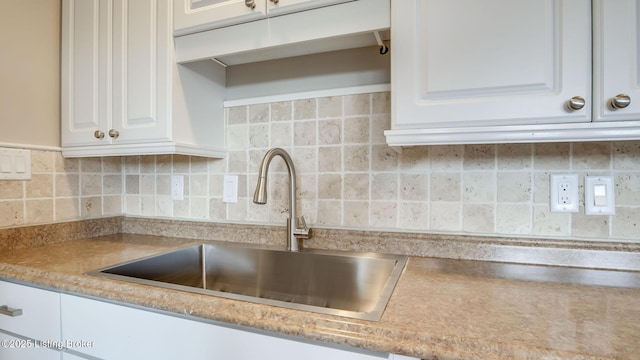 4720 Ferrer Way, Jeffersontown, KY 40299 - kitchen view of white cabinets, decorative backsplash, and light countertops