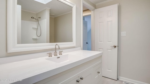 4720 Ferrer Way, Jeffersontown, KY 40299 - bathroom with ornamental molding, vanity, and a shower