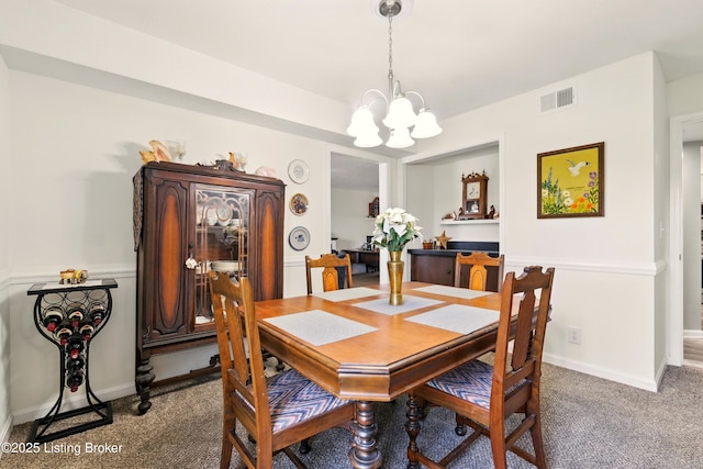 111 La Fontenay Ct, Louisville, KY 40223 - carpeted dining room with a chandelier and baseboards