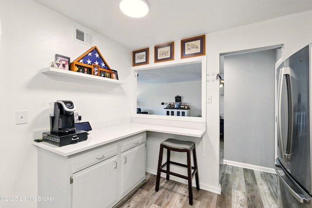 111 La Fontenay Ct, Louisville, KY 40223 - kitchen featuring freestanding refrigerator, light countertops, wood finished floors, white cabinets, and open shelves