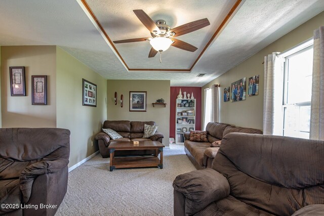 2923 High Plains Rd, Vine Grove, KY 40175 - living area with healthy amount of natural light, carpet flooring, ceiling fan, and a textured ceiling