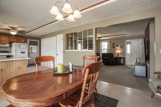 2923 High Plains Rd, Vine Grove, KY 40175 - dining space with ceiling fan, a textured ceiling, a chandelier, light flooring, and light colored carpet
