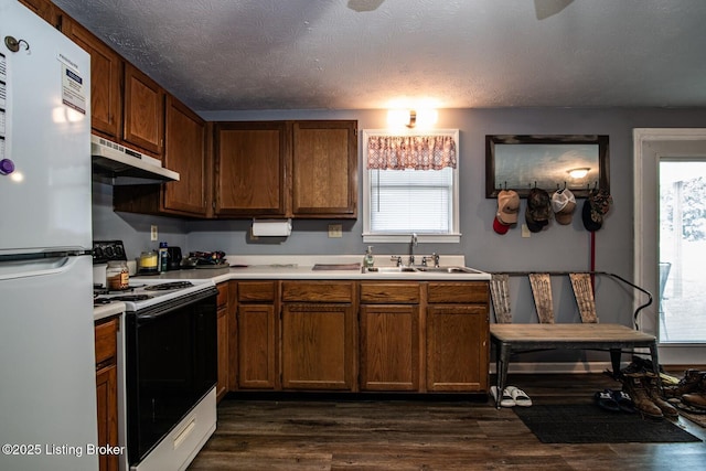 2923 High Plains Rd, Vine Grove, KY 40175 - kitchen featuring white appliances, under cabinet range hood, light countertops, and dark wood-style floors