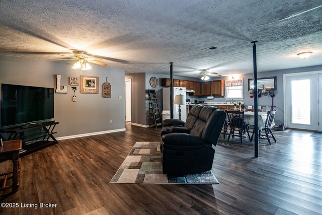 2923 High Plains Rd, Vine Grove, KY 40175 - living area featuring a ceiling fan, dark wood-style floors, and a textured ceiling