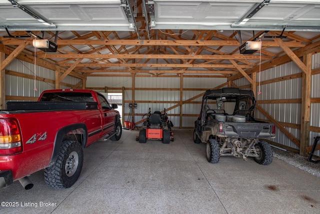 2923 High Plains Rd, Vine Grove, KY 40175 - garage with a garage door opener and metal wall