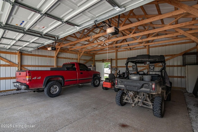2923 High Plains Rd, Vine Grove, KY 40175 - garage with a garage door opener and metal wall