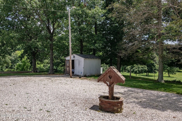2923 High Plains Rd, Vine Grove, KY 40175 - view of yard with a storage shed and view of wooded area