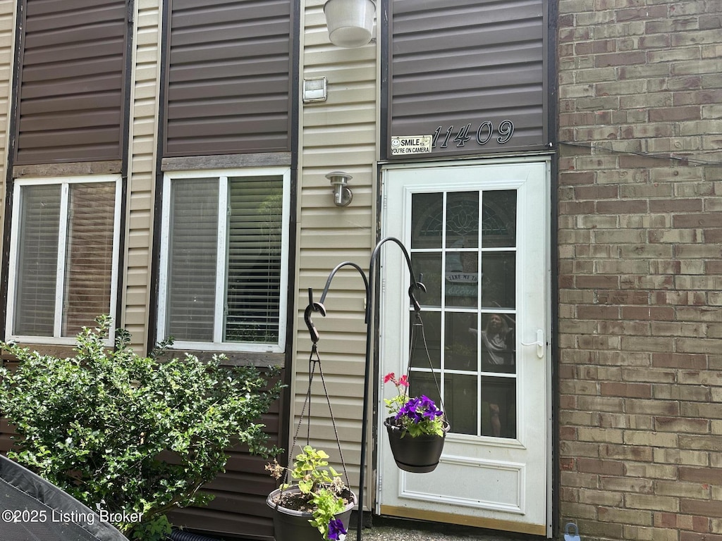 11409 N Tazwell Dr, Louisville, KY 40241 - doorway to property featuring brick siding