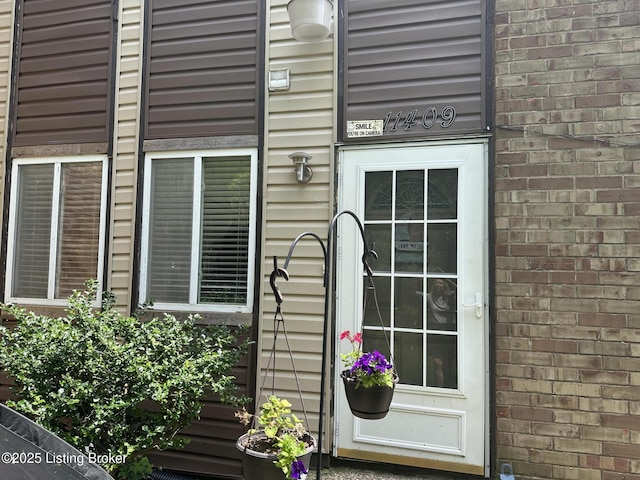 11409 N Tazwell Dr, Louisville, KY 40241 - doorway to property featuring brick siding