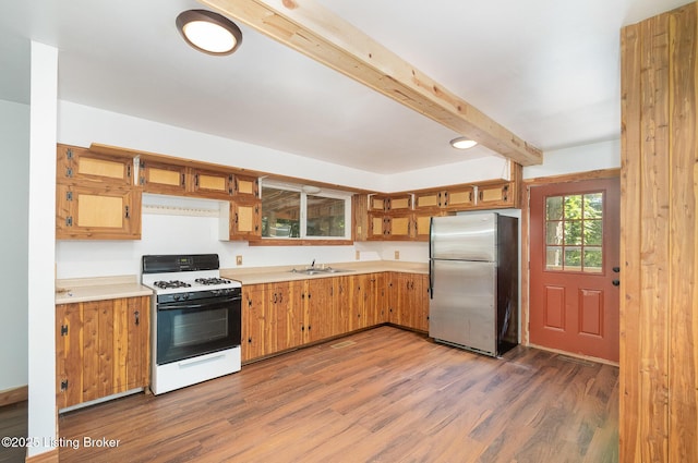1465 Swope Rd, Owenton, KY 40359 - kitchen featuring range with gas cooktop, freestanding refrigerator, beamed ceiling, wood finished floors, and light countertops