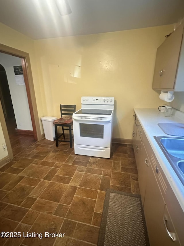 126 Taylorsville Rd, Bloomfield, KY 40008 - kitchen featuring electric range, dark stone finish flooring, and light countertops