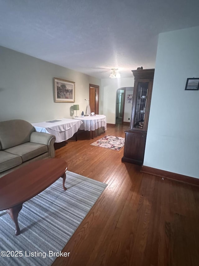 126 Taylorsville Rd, Bloomfield, KY 40008 - living room featuring dark wood-type flooring and arched walkways
