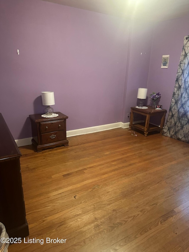 126 Taylorsville Rd, Bloomfield, KY 40008 - unfurnished bedroom with wood finished floors and baseboards