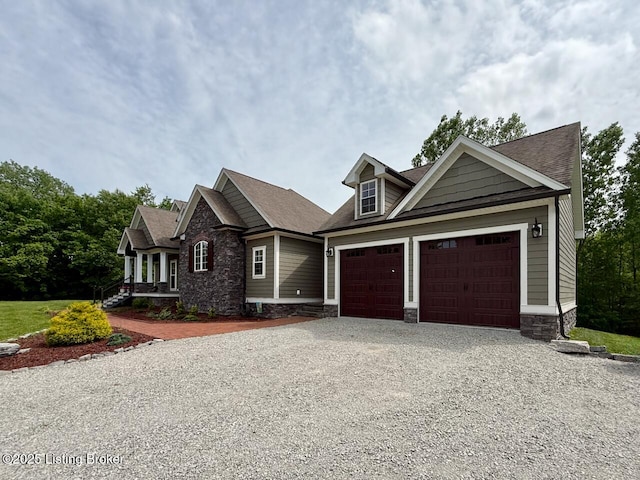 3637 Mount Washington Rd, Taylorsville, KY 40071 - craftsman-style home with driveway, stone siding, an attached garage, and roof with shingles