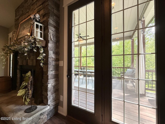 3637 Mount Washington Rd, Taylorsville, KY 40071 - doorway to outside with a stone fireplace, plenty of natural light, and dark wood-style flooring