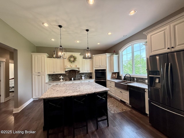 3637 Mount Washington Rd, Taylorsville, KY 40071 - kitchen featuring black appliances, a kitchen island, decorative backsplash, light stone counters, and dark wood-style floors
