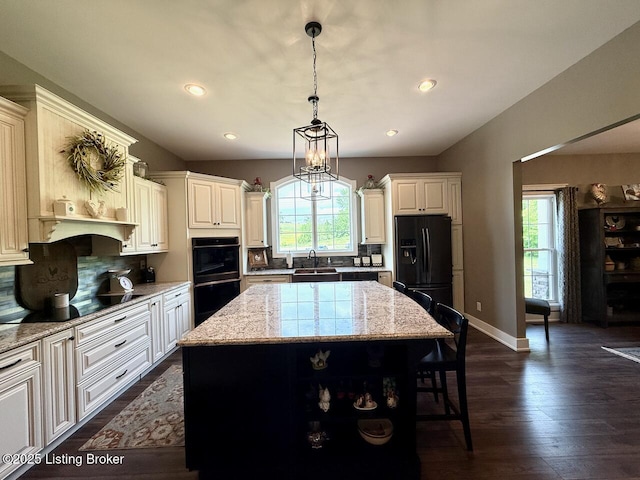 3637 Mount Washington Rd, Taylorsville, KY 40071 - kitchen featuring black appliances, plenty of natural light, a kitchen bar, dark wood-style floors, and recessed lighting