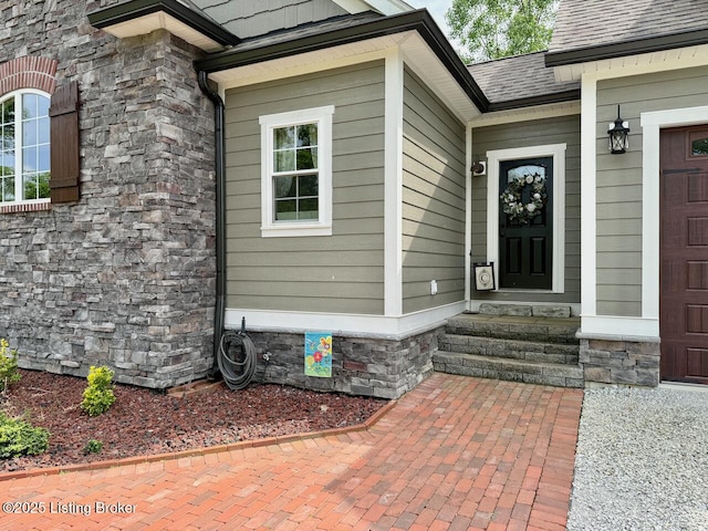 3637 Mount Washington Rd, Taylorsville, KY 40071 - view of exterior entry featuring stone siding and a shingled roof