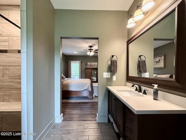 3637 Mount Washington Rd, Taylorsville, KY 40071 - ensuite bathroom featuring vanity, wood finished floors, and ceiling fan