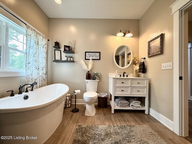 3637 Mount Washington Rd, Taylorsville, KY 40071 - full bathroom featuring wood finished floors, vanity, and a freestanding tub