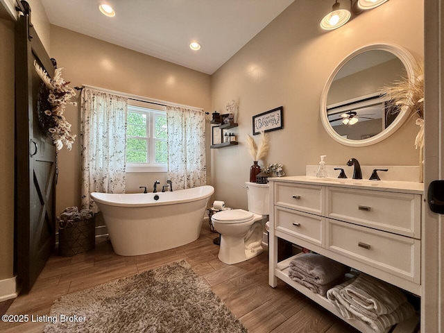 3637 Mount Washington Rd, Taylorsville, KY 40071 - full bath featuring vanity, a soaking tub, ceiling fan, wood finished floors, and recessed lighting