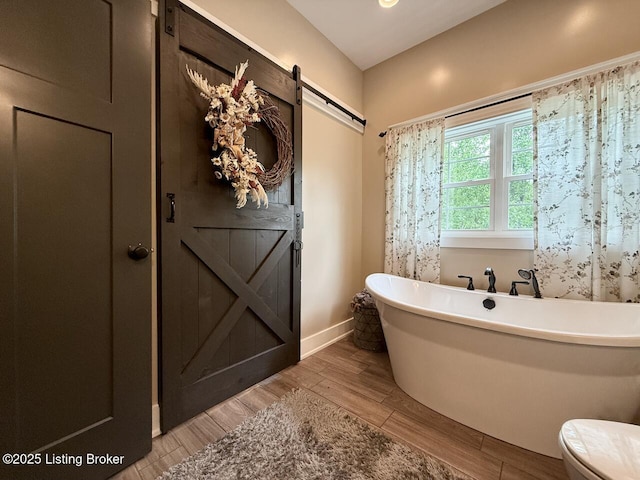 3637 Mount Washington Rd, Taylorsville, KY 40071 - bathroom with a soaking tub and wood finished floors