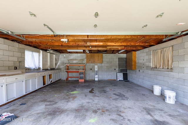 7502 Sam Ct, Louisville, KY 40214 - garage with concrete block wall