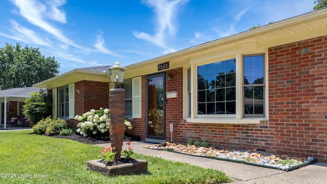 7502 Sam Ct, Louisville, KY 40214 - entrance to property with brick siding and a yard