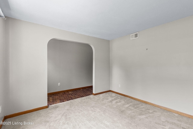 7502 Sam Ct, Louisville, KY 40214 - unfurnished room featuring arched walkways and carpet floors